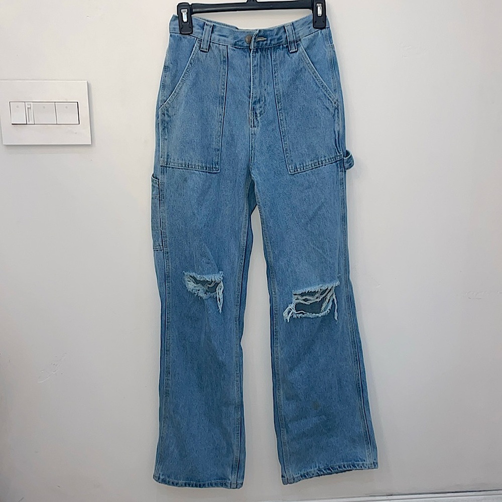Medium blue straight leg jeans with pocket on the leg.